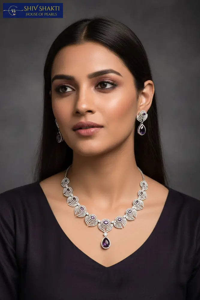 silver Jewelry set with necklace and earrings on a black background